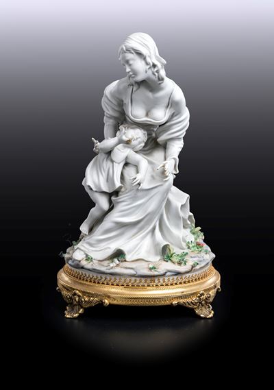 Capodimonte, Gruppo in biscuit e porcellana “Mamma con bambino” su base in bronzo, inizio XX seco...