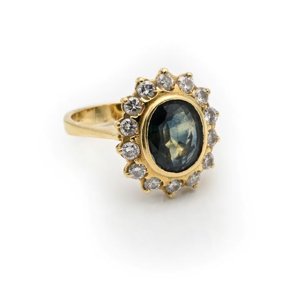 Anello classico in oro, zaffiro e brillanti