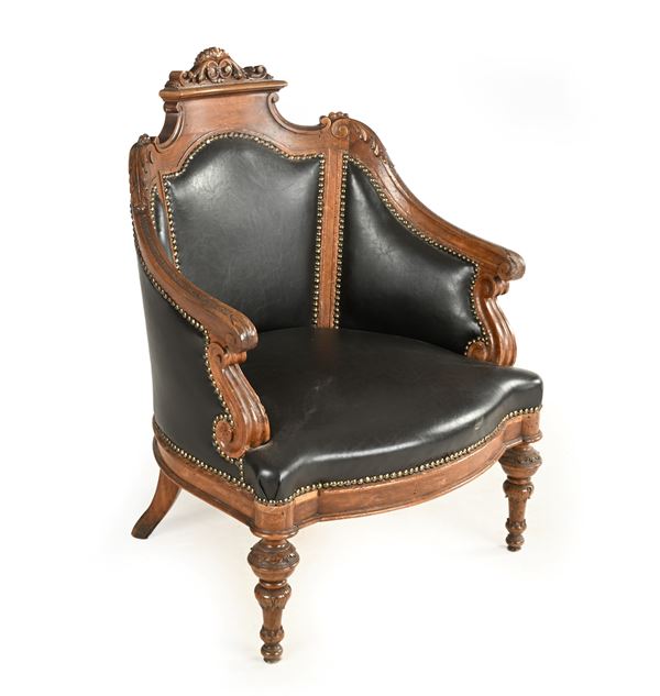 Poltroncina in noce e cuoio, XX secolo