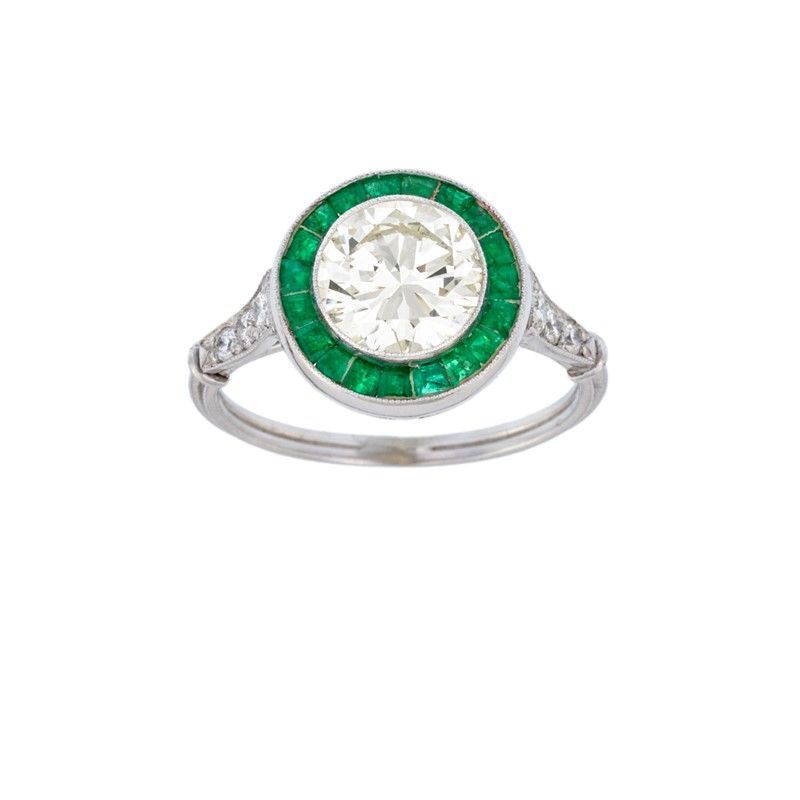 Anello in Oro Bianco con Brillante e Smeraldi