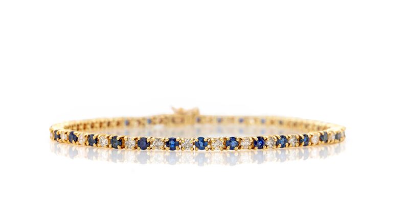 Bracciale tennis in oro, zaffiri e brillanti