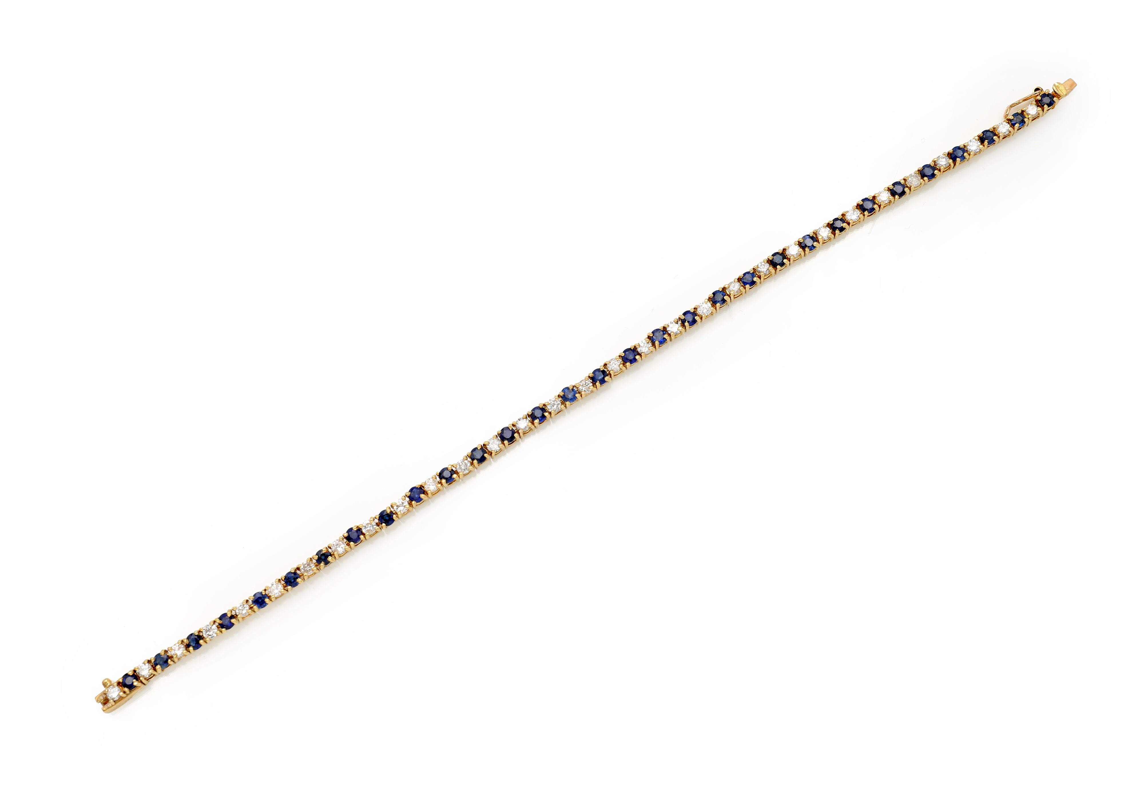 Bracciale tennis in oro, zaffiri e brillanti