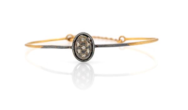 Bracciale rigido in oro, argento e diamanti