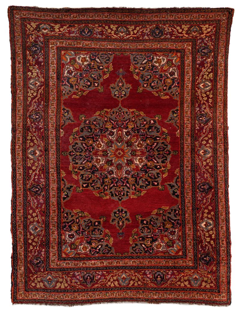 Tappeto persiano Kashan fondo rosso rubino con rosone centrale, XX secolo