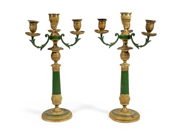 Coppia di candelieri a doppio uso in metallo dorato, seconda metà del XIX secolo