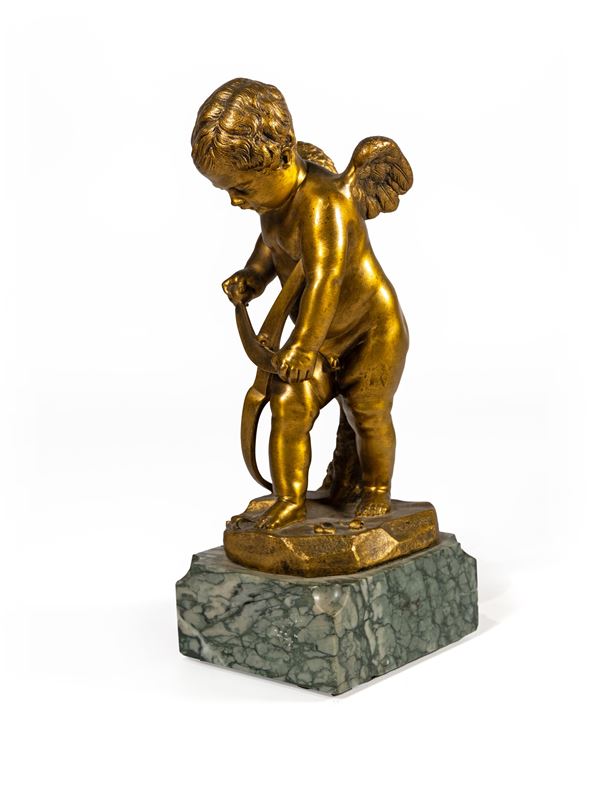 Cupido che intaglia il suo arco