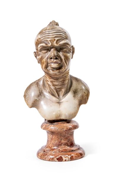 Busto di servitore moro in marmo bianco, XIX secolo, con piedistallo in marmo venato rosso