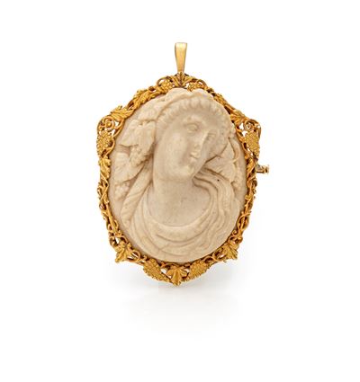 Spilla in oro giallo 750/000 con cammeo in pietra lavica raffigurante Bacco