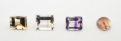 Lotto di quattro quarzi bicolor in taglio gradini, ct 26,35 complessivi