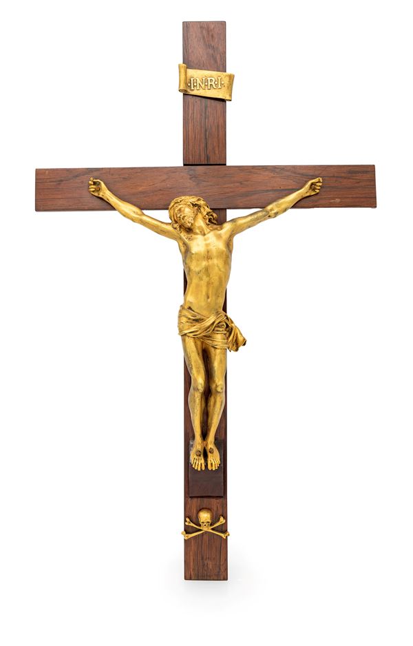 Cristo crocifisso in bronzo dorato su croce in legno, XVIII secolo