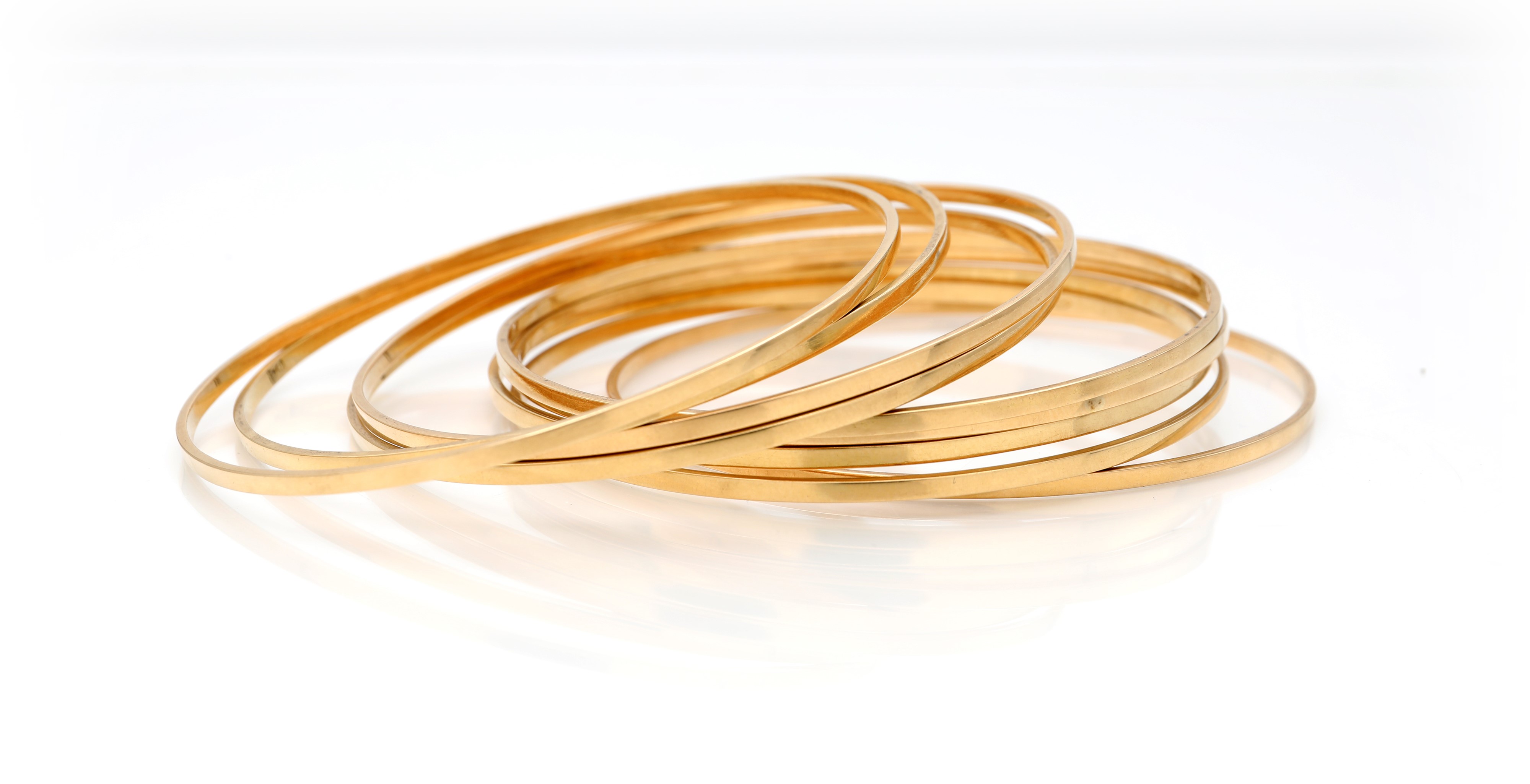 Gruppo di nove bracciali rigidi, oro giallo 750/000