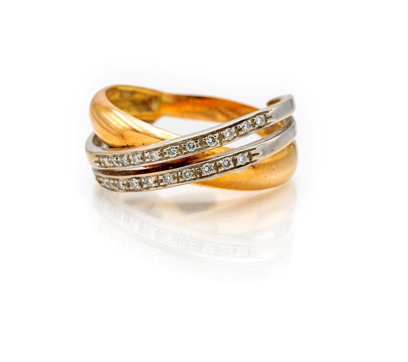 Anello ad incrocio in oro giallo e bianco 750/000 con brillanti