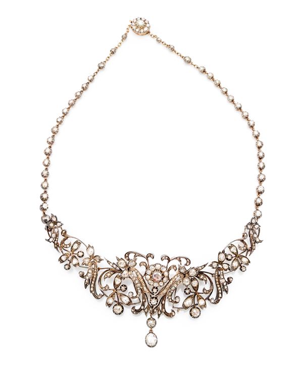 Collana pettorale in oro, argento, diamanti.