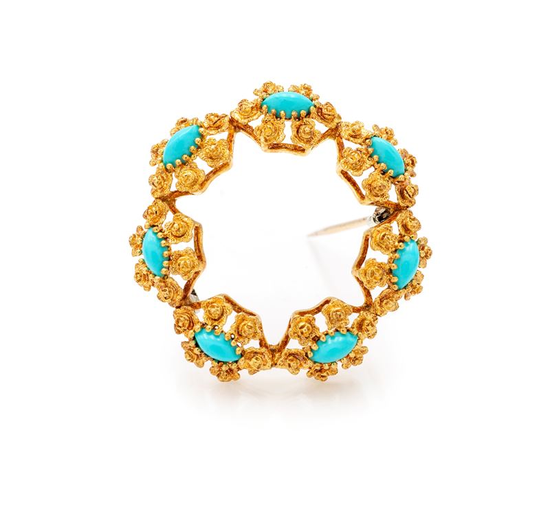 Spilla tonda in oro 750/000 con turchesi