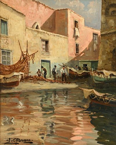 Barche e pescatori presso borgo costiero