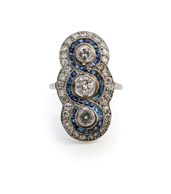 Anello tipo decò in platino, diamanti e zaffiri