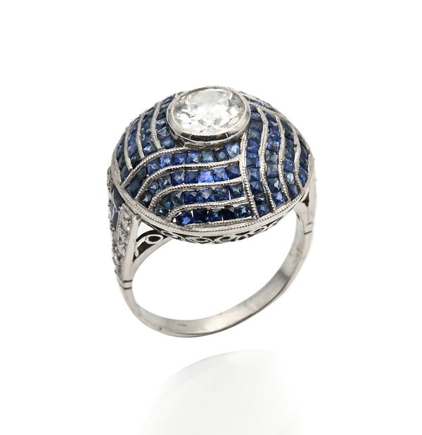 Anello tipo decò in platino, diamanti e zaffiri