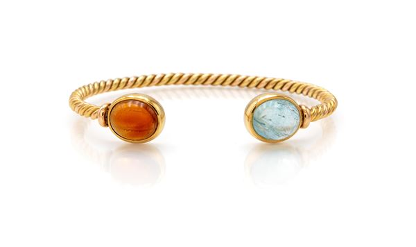 Bracciale a manetta in oro e topazi