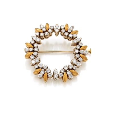 Spilla tonda in oro giallo 750/000 e diamanti taglio brillante