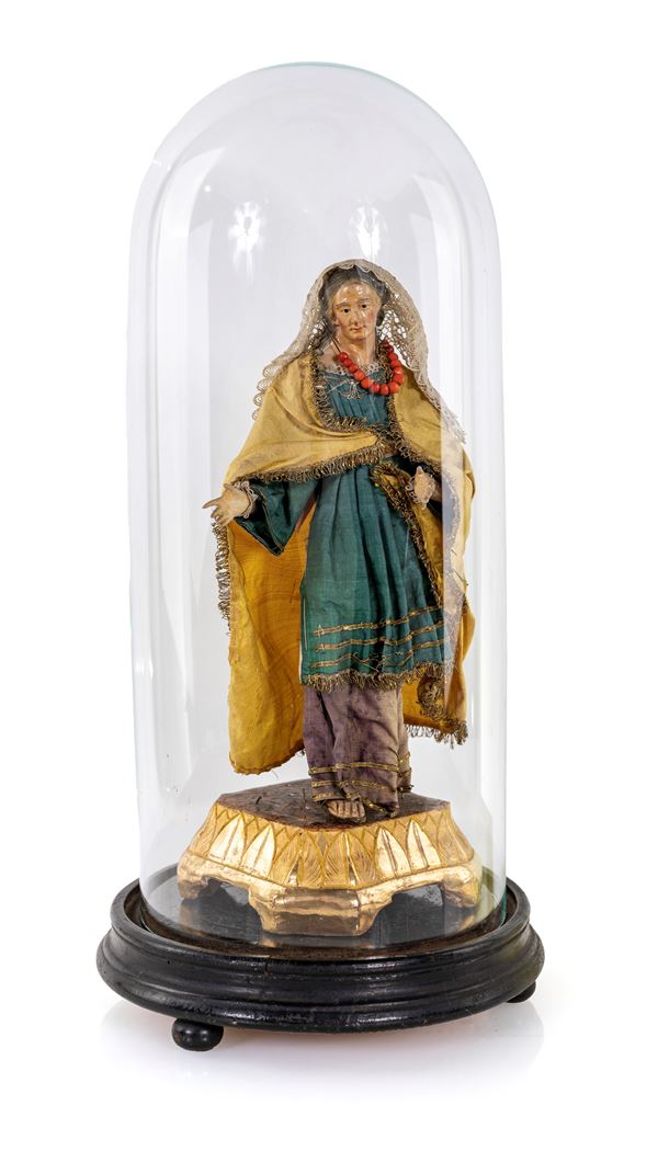 Figura da presepe (Sant'Anna) sotto campana in vetro