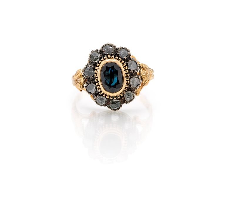 Anello in oro giallo 750/000 e argento con diamanti e zaffiro