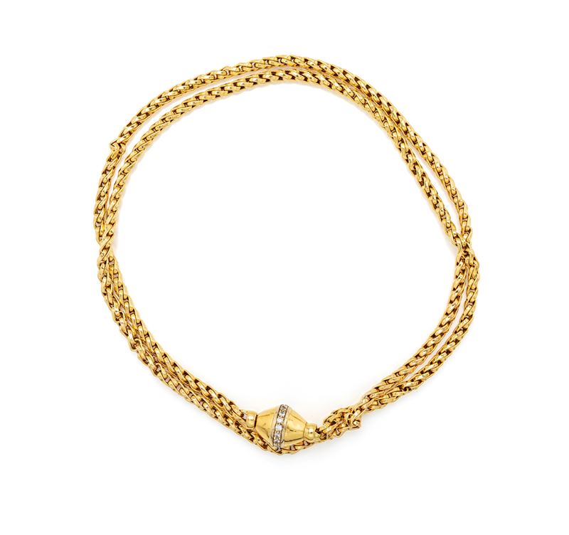 Lunga collana a laccio in oro giallo 750/000 e brillanti