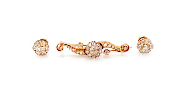 Parure di spilla e coppia di orecchini in oro e diamanti