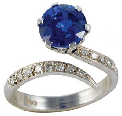 Anello in Oro Bianco con Zaffiro Blu Tondo