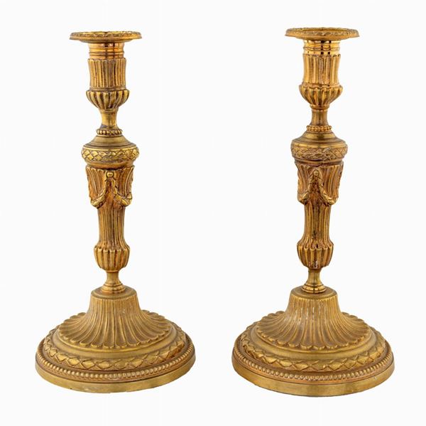 Coppia di candelieri   - Asta Antiquariato Dipinti Antichi e del XIX secolo, Arredi, Tappeti, e Argenti - Casa d'Aste Arcadia